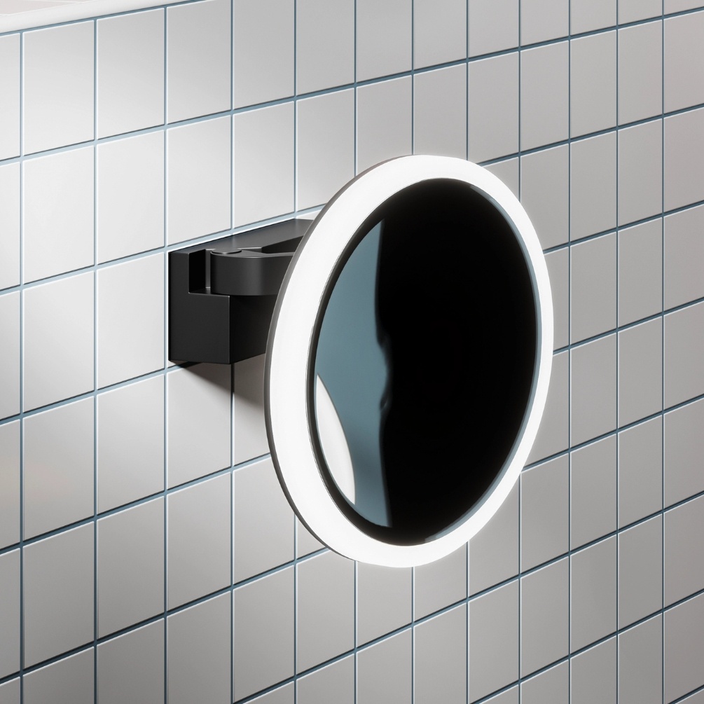 Lifestyle image of the hib. Cirque Black LED Magnifying Mirror